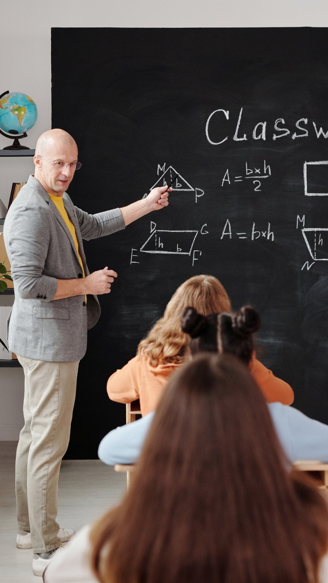 Students studying in a classroom preparing for higher education abroad